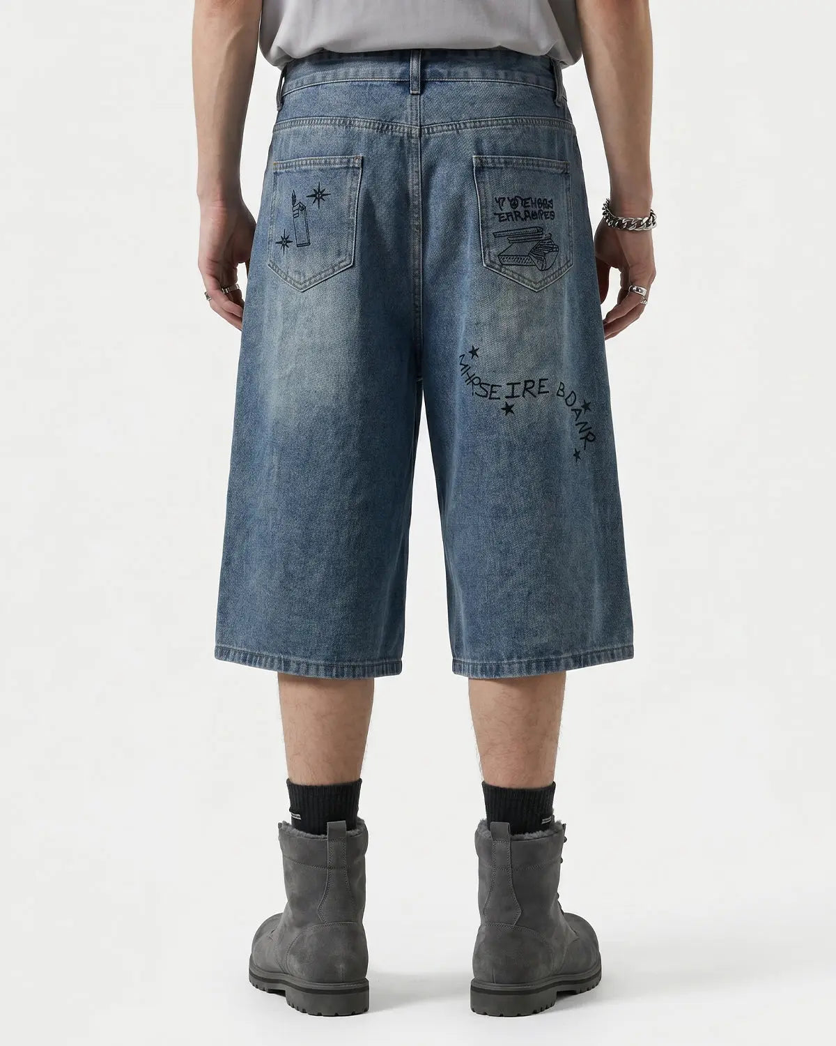 Washed graffiti longline jorts by INFLATION, stylish streetwear pants with a relaxed fit and artistic design.