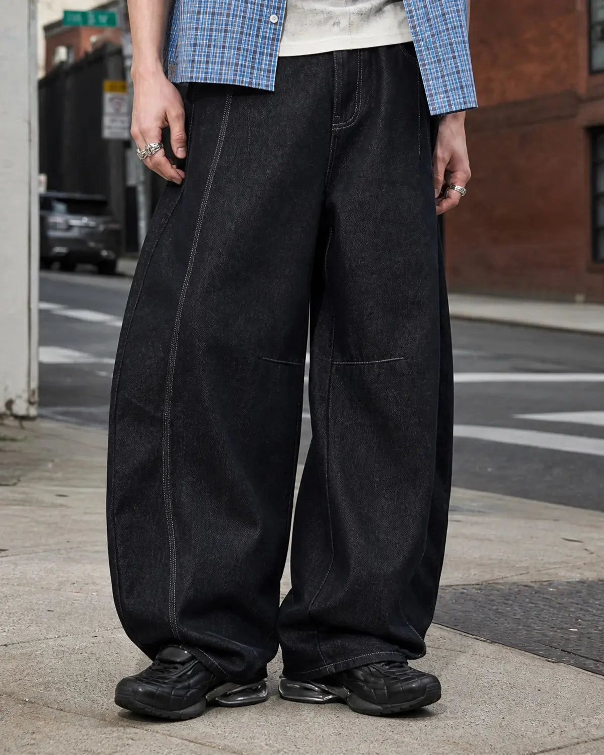INFLATION Raw Color Barrel Baggy Jeans showing relaxed fit denim pants with raw hem details and baggy style.