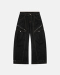 Black Super Barrel jeans by INFLATION, men's streetwear pants with a relaxed fit and modern design, shown on a model.