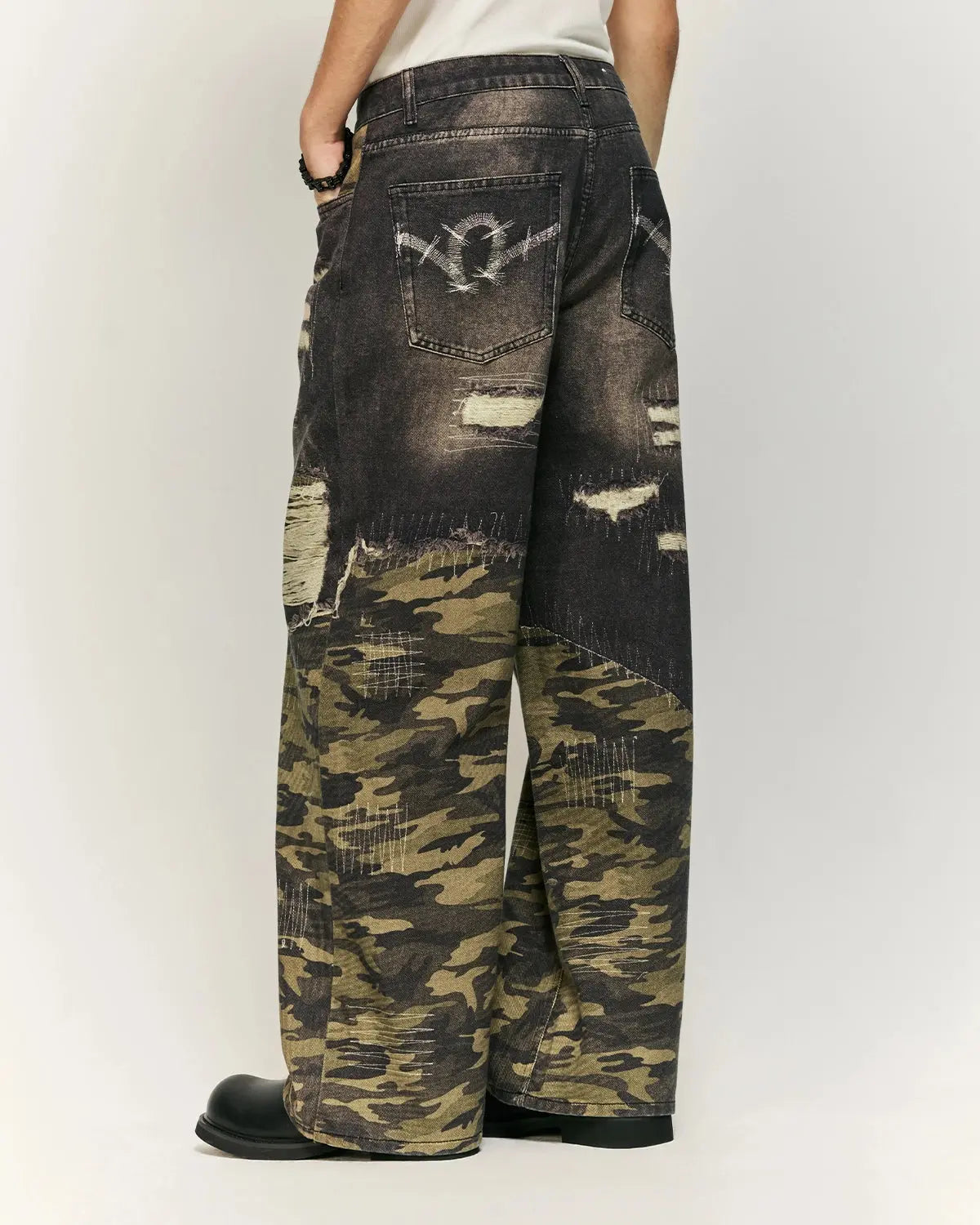 Camo digital printing baggy jeans by INFLATION, streetwear style with loose fit and camouflage design, displayed on a model.