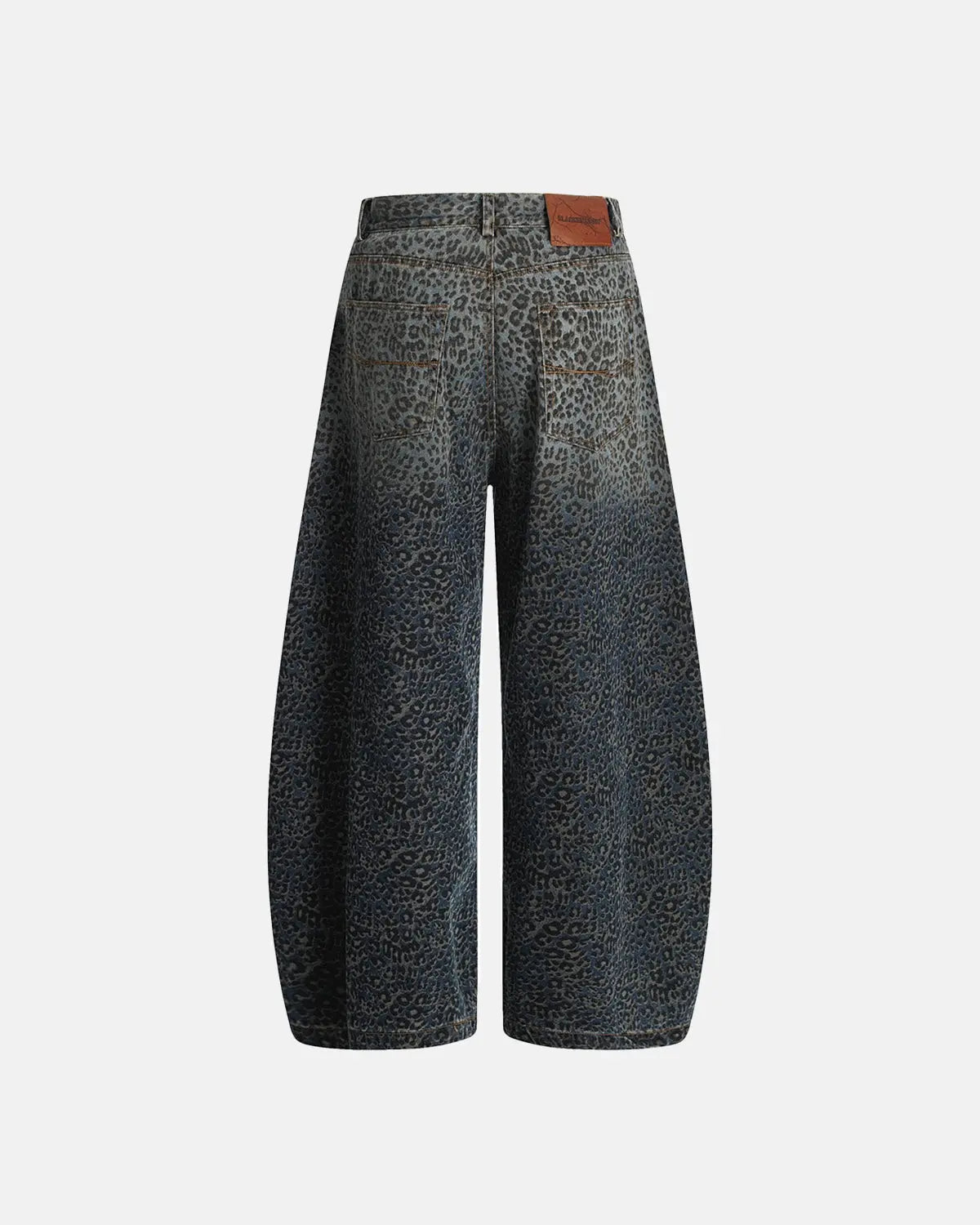 Vintage leopard print barrel jeans by INFLATION featuring bold animal print and relaxed fit, perfect for streetwear style.