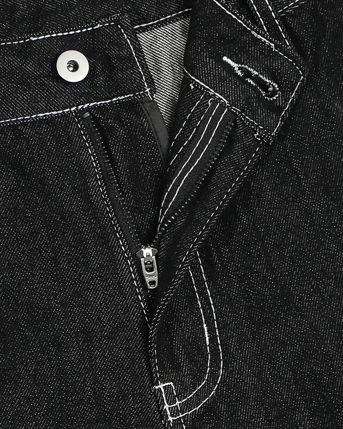 Raw denim cargo longline shorts by INFLATION, featuring multiple pockets, distressed details, and a relaxed fit on pants.