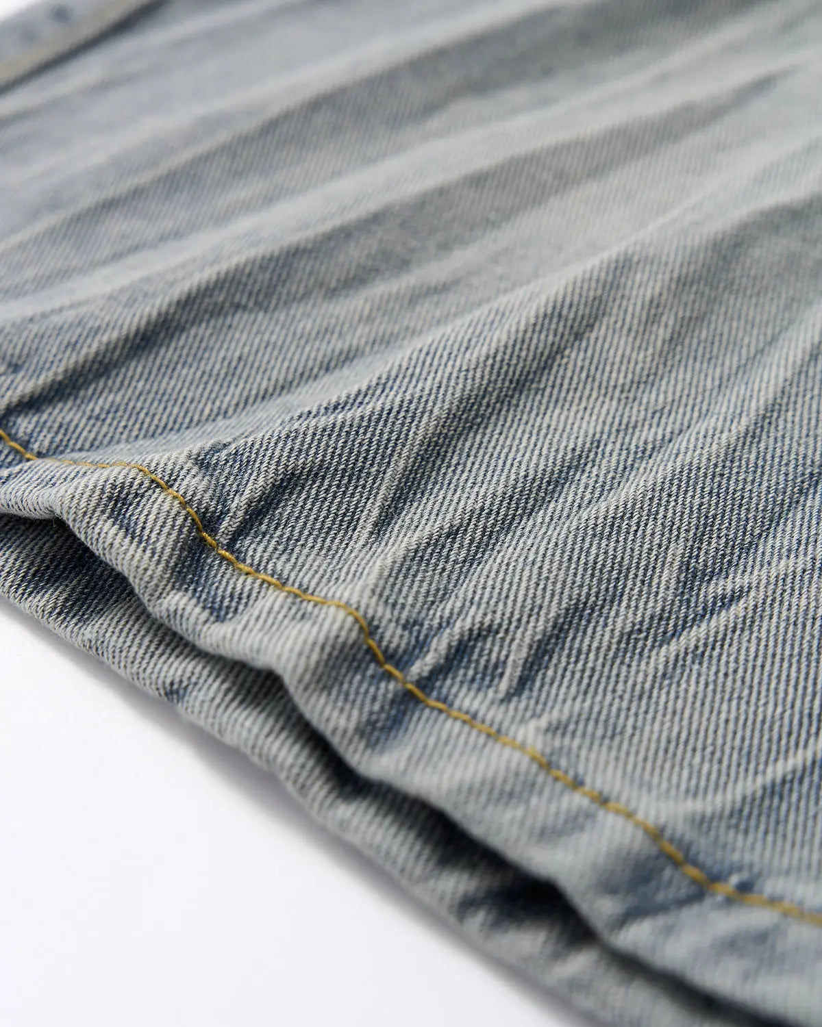 Textured washed longline jorts pants by INFLATION Streetwear, featuring a relaxed fit and distressed denim detail.