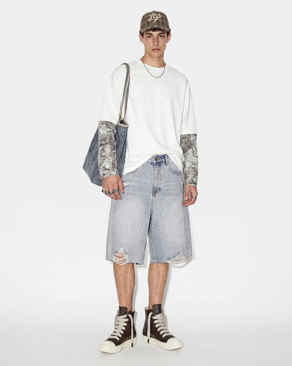 Inflation brand adjustable waist baggy jorts with relaxed fit, denim style pants featuring a casual streetwear design.