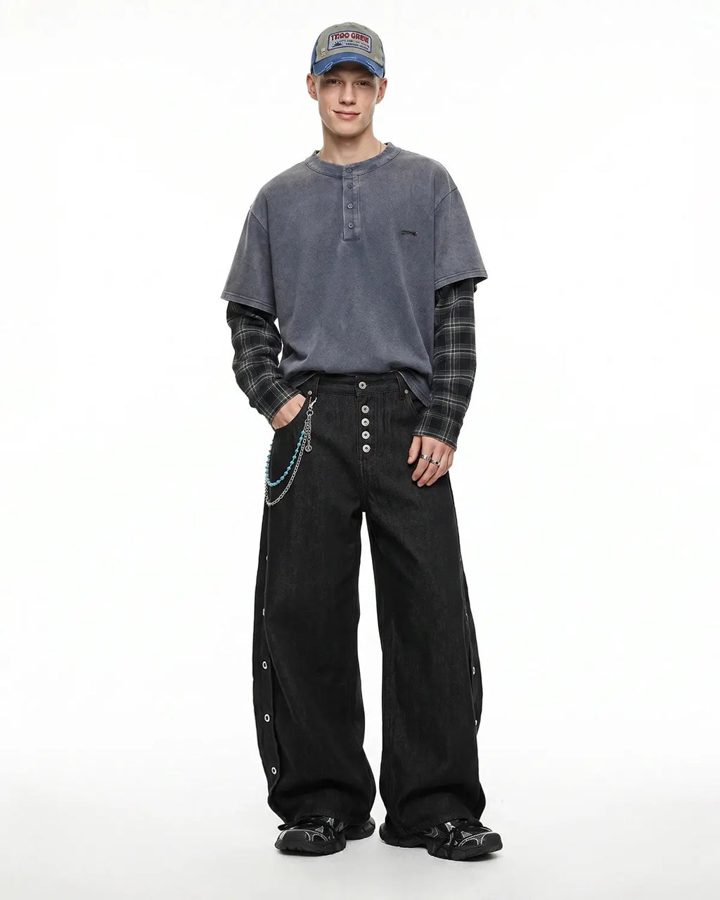 Inflation Streetwear barrel jeans with side eyelet buttons, showcasing a stylish denim design and button details.