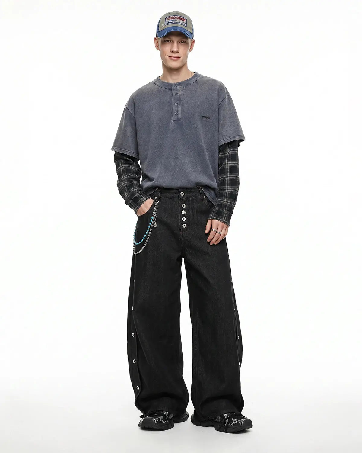 Inflation Streetwear barrel jeans with side eyelet buttons, showcasing a stylish denim design and button details.