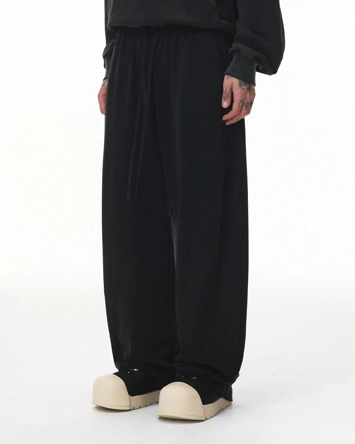 INFLATION Garment Wash French Terry Straight-leg Sweatpant in neutral color, showcasing relaxed fit and soft fabric texture.
