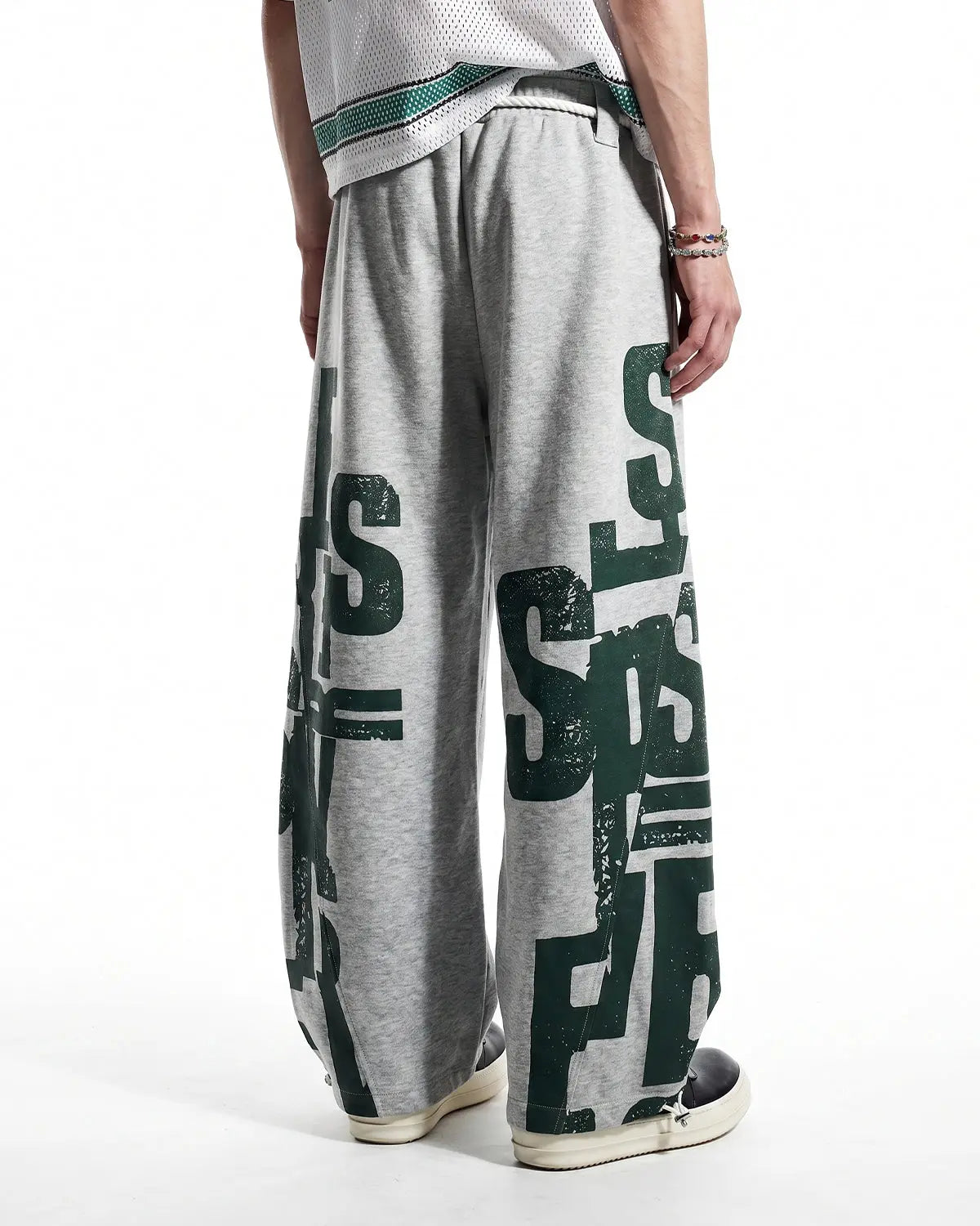 Inflation Streetwear graphic barrel sweatpants featuring bold print and relaxed fit, shown on a model.