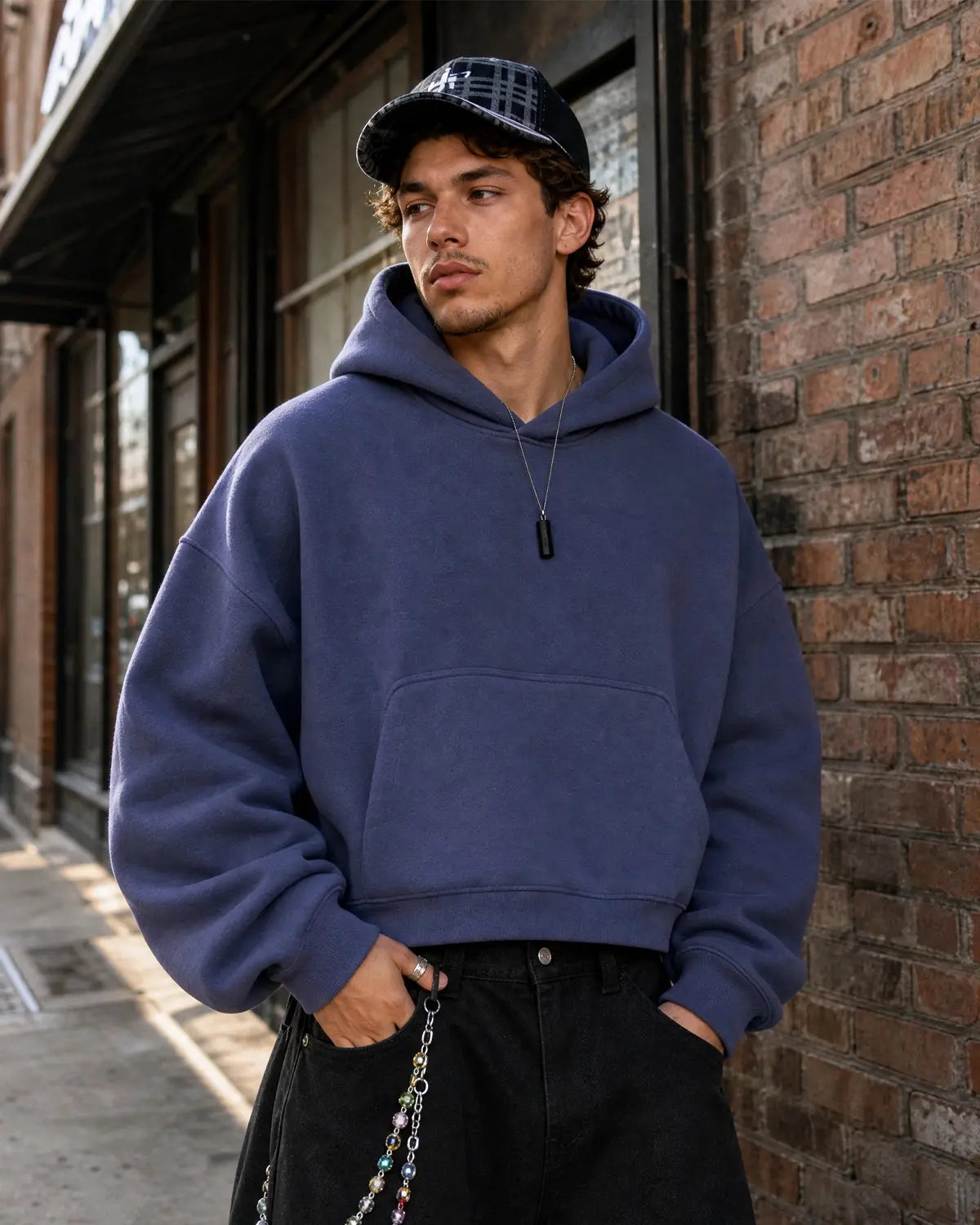 Blank Comfy Boxy Fit Hoodie by INFLATION, showing a casual black hoodie with a relaxed, oversized fit and soft fabric.