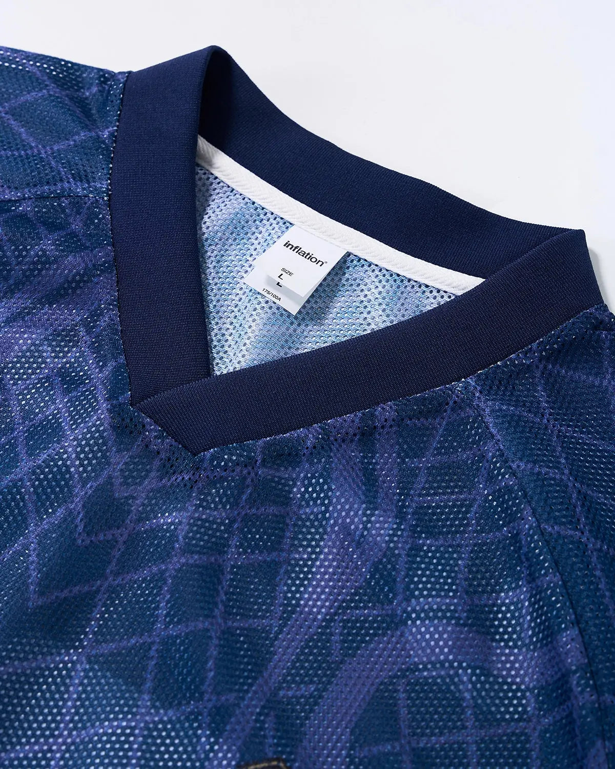 Inflation Streetwear geometric pattern mesh jersey t-shirt with bold design, lightweight fabric, and modern streetwear style.
