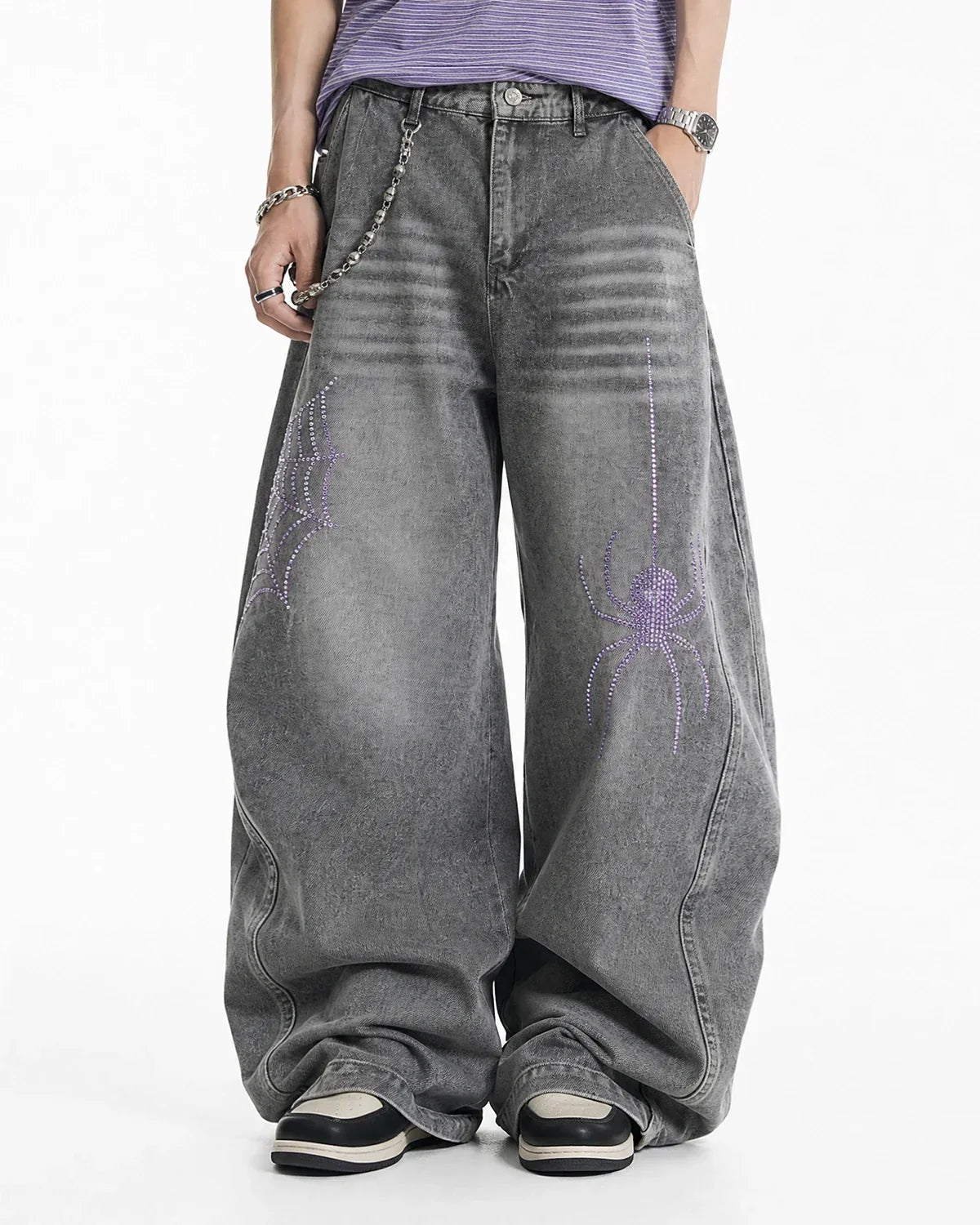 Inflation Spider Graphic Rhinestone Barrel Jeans showing dark denim pants with spider and rhinestone embellishments on the legs.