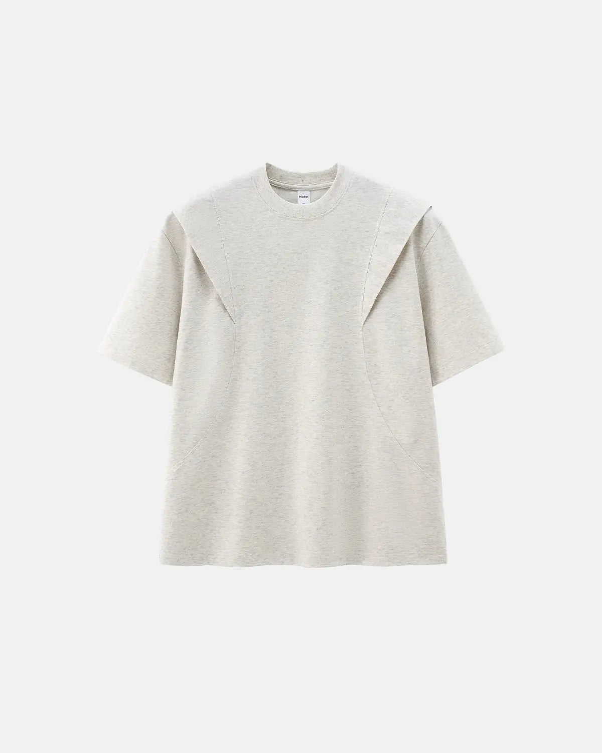 Deconstructed oversized T-shirt by INFLATION featuring a loose fit and distressed design, displayed on a hanger.