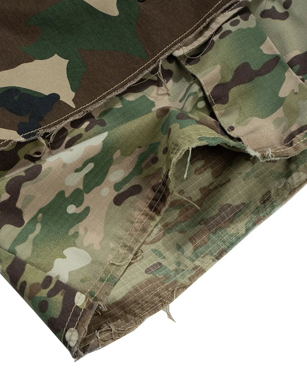 Camo layered longline jorts by Inflation Streetwear featuring a relaxed fit and distressed denim with camouflage pattern.