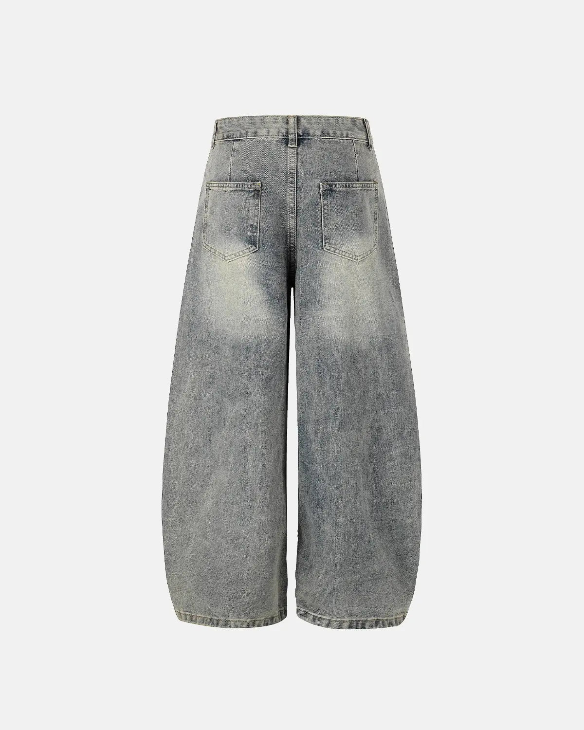 Distressed eyelet barrel jeans by INFLATION featuring a faded denim look and eyelet details, styled with a relaxed fit.