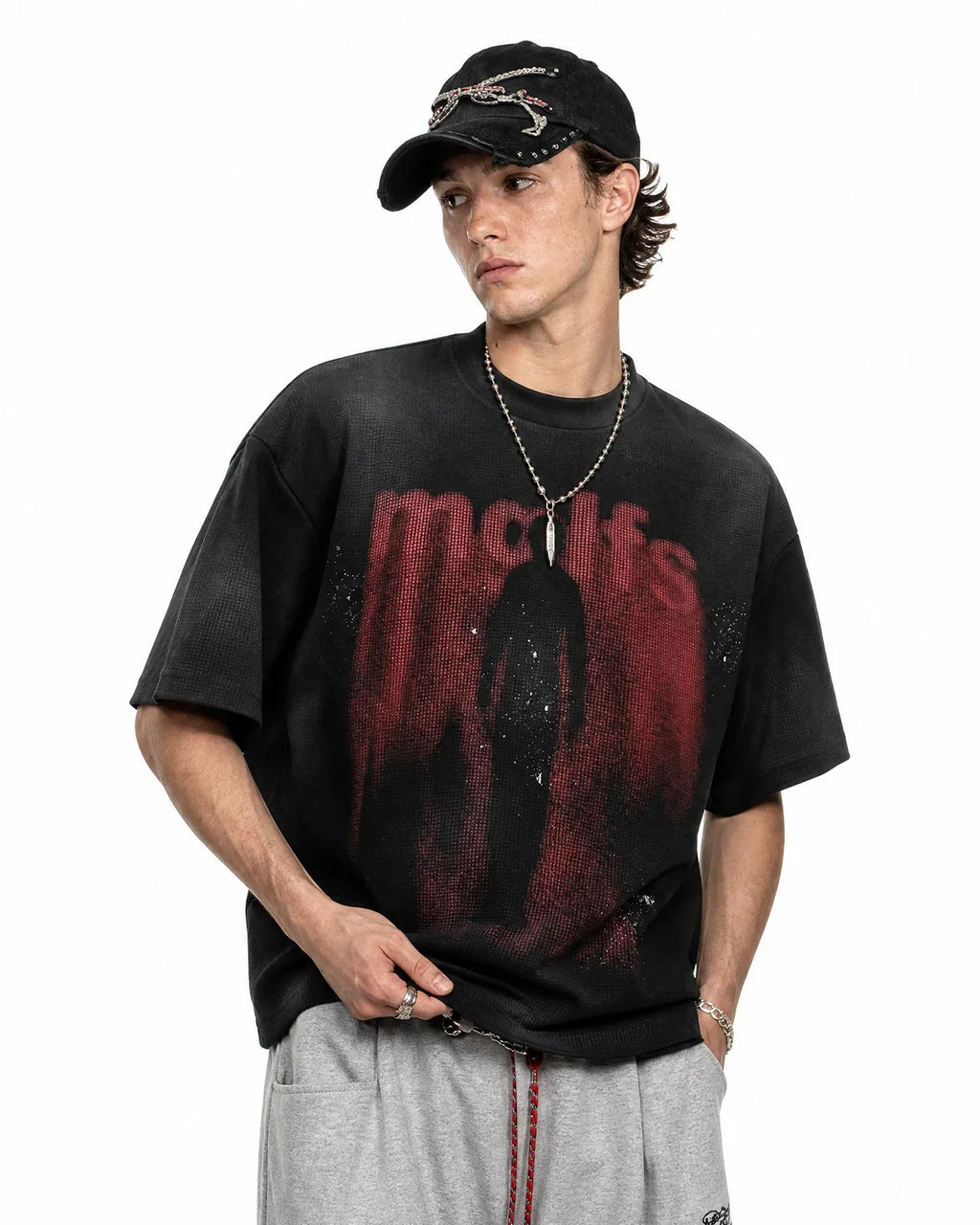 Black cotton T-shirt with Gothic letter print by INFLATION, streetwear style, front view showing bold letter design.