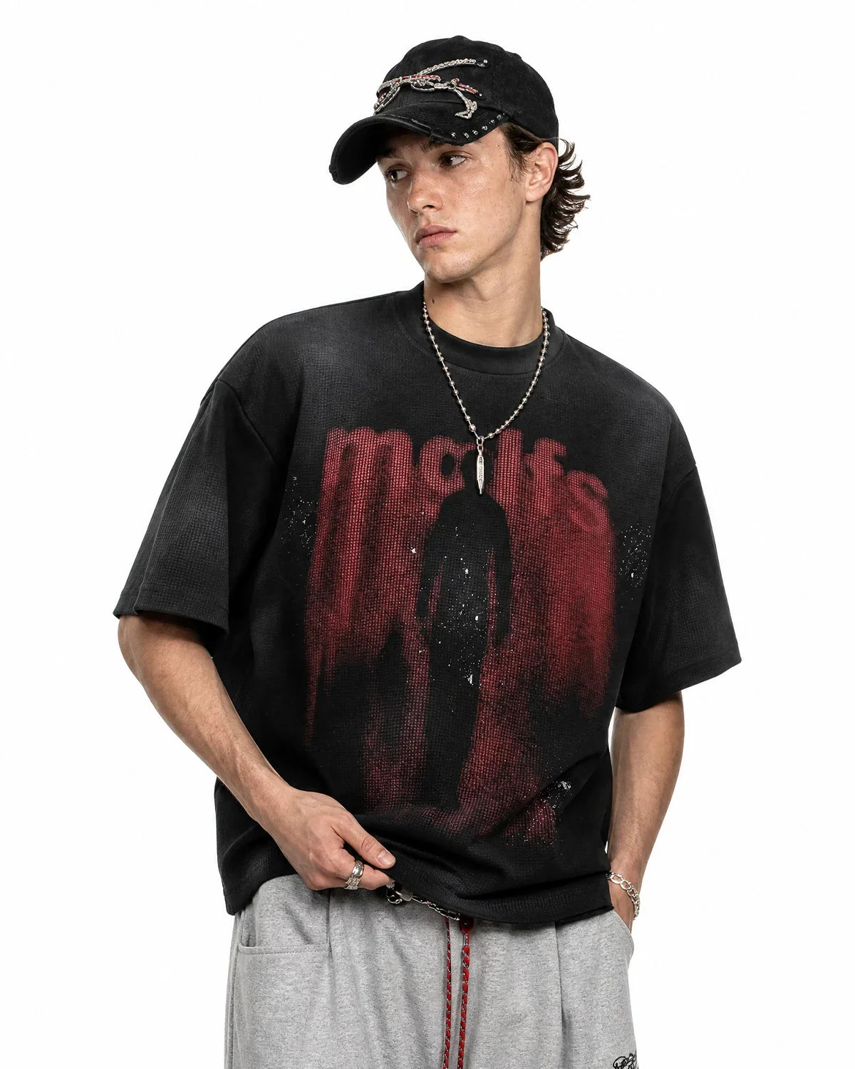 Black cotton T-shirt with Gothic letter print by INFLATION, streetwear style, front view showing bold letter design.