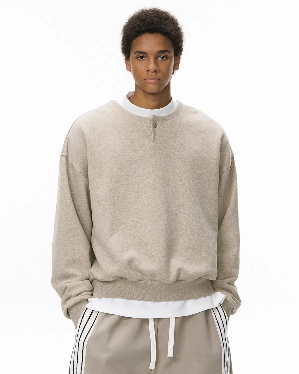 Inflation Streetwear boxy fit henley collar sweatshirt in neutral color, featuring a relaxed fit and classic buttoned neckline.