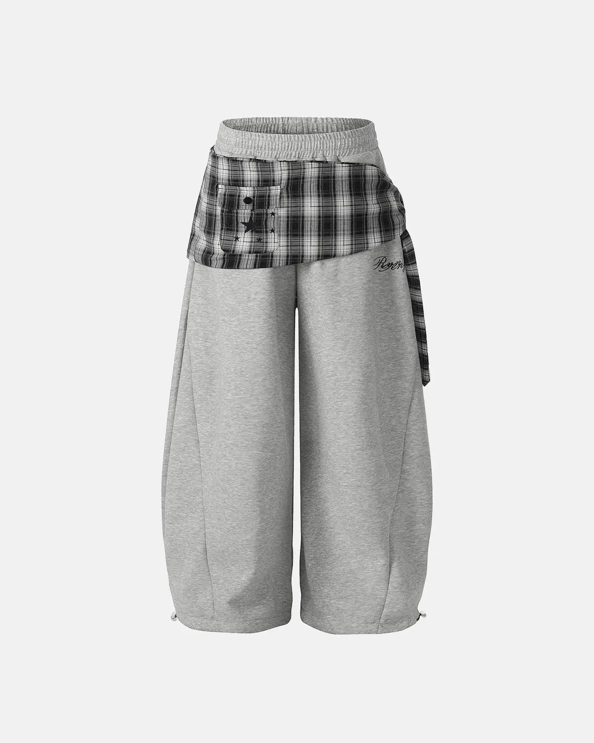 Inflation Streetwear plaid layered baggy sweatpants with relaxed fit and bold plaid pattern, displayed on a hanger.