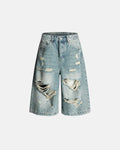 Distressed longline jorts from Inflation Streetwear, denim pants with frayed edges and a relaxed fit for casual style.