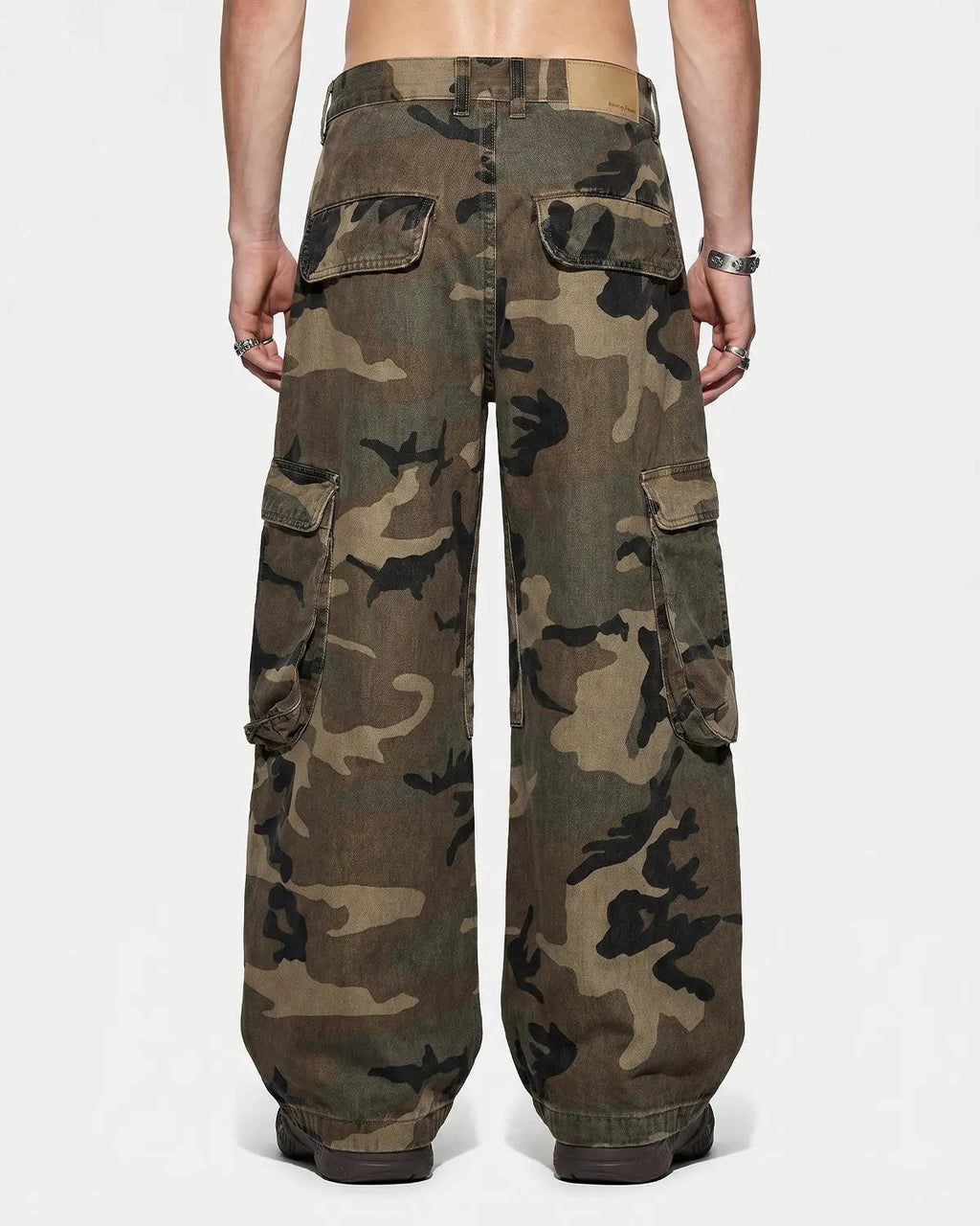 Inflation Camo Cargo Barrel Pants with multiple pockets, relaxed fit, and streetwear style in a camouflage pattern.