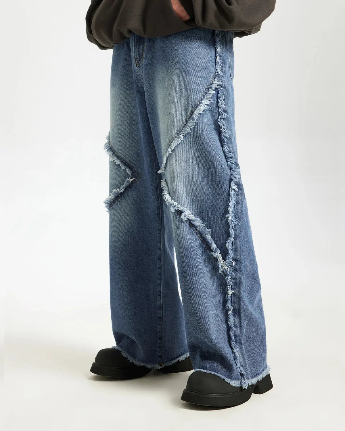 Blue frayed acid wash pants from Inflation Streetwear featuring distressed details and relaxed fit.