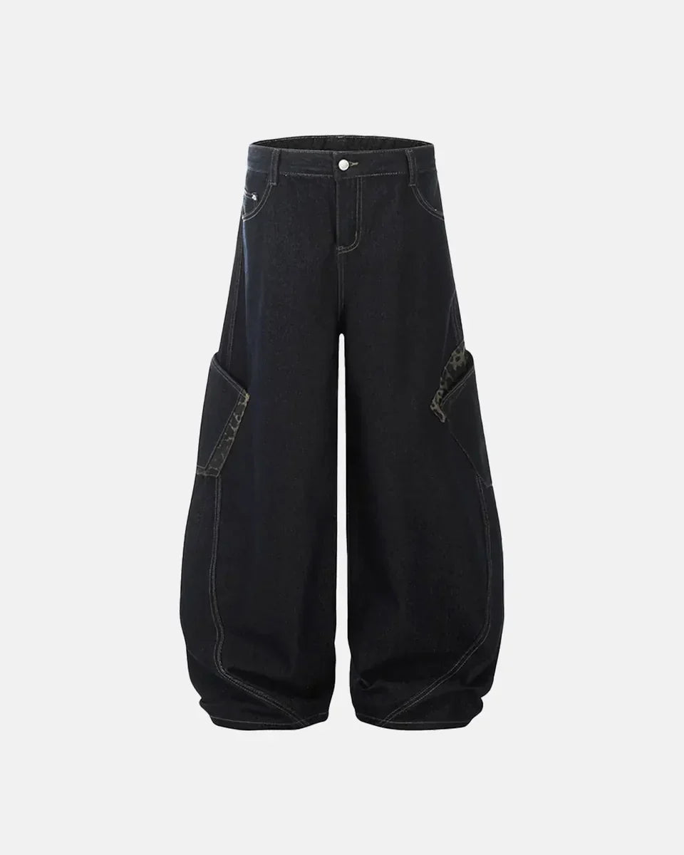 Leopard patchwork barrel jeans by Inflation Streetwear featuring mixed animal print fabric and relaxed fit style.