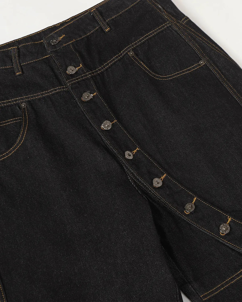 Inflation Buttons Up Raw Baggy Jeans featuring a relaxed fit, raw denim, and button details, styled for streetwear fashion.