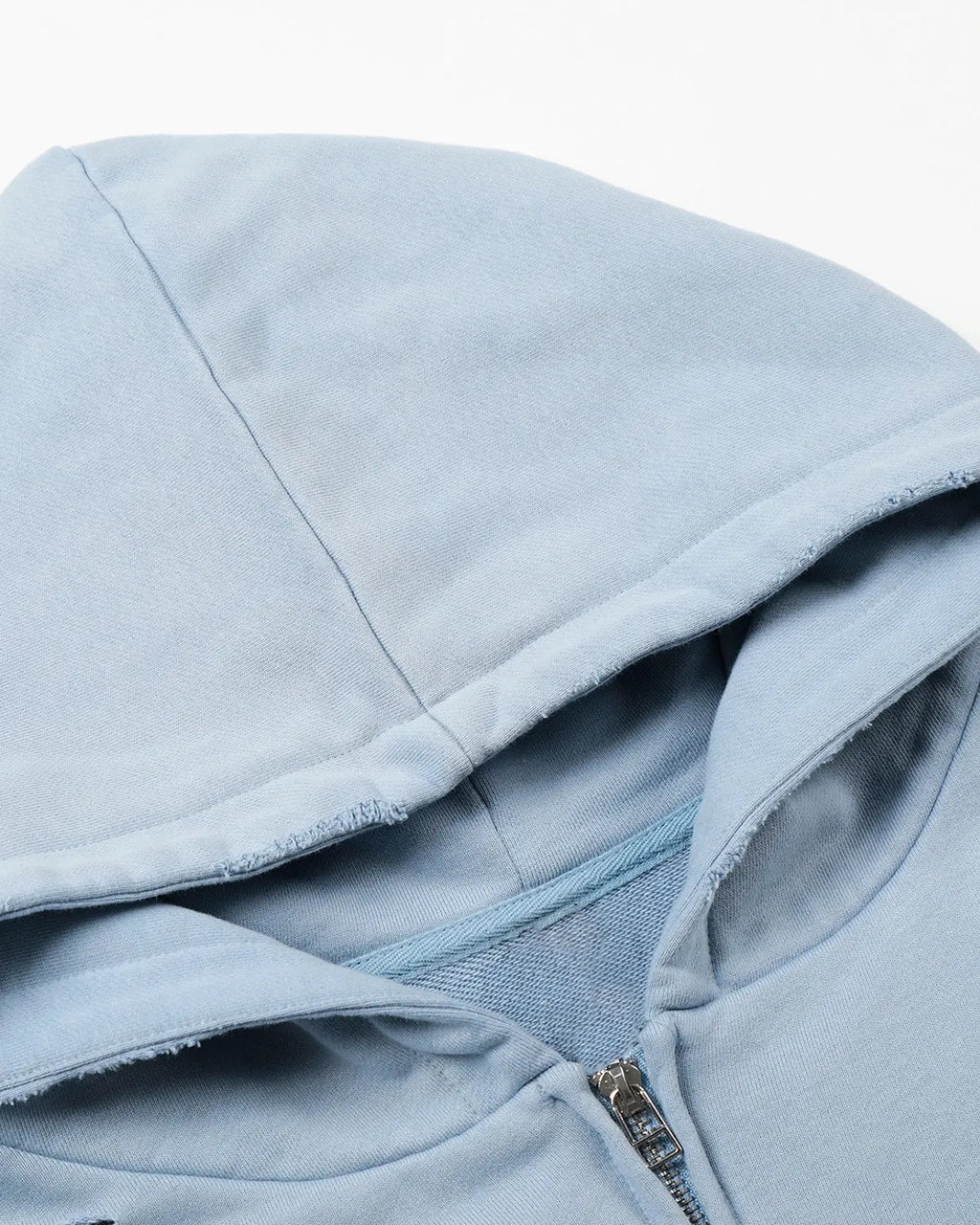 Inflation streetwear graffiti character distressed washed zip hoodie with bold graphic design on front and faded denim fabric.