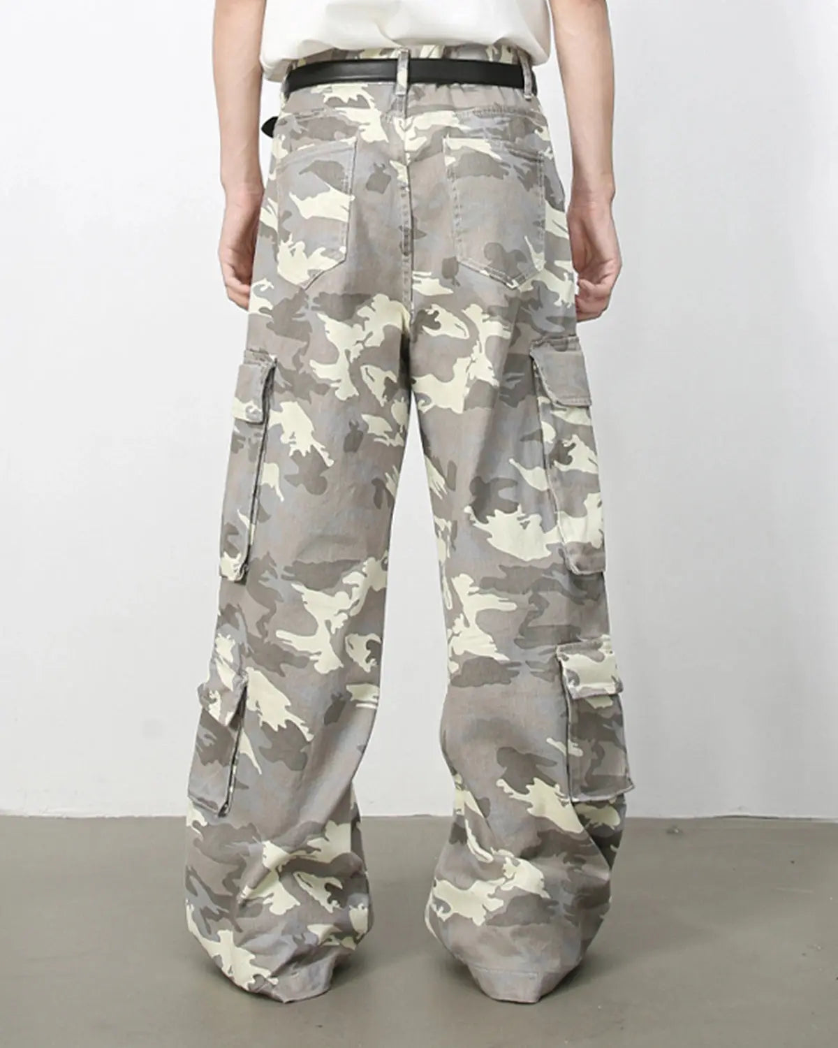 Vintage camo cargo pants by INFLATION, streetwear style with multiple pockets and a relaxed fit, shown on a model.