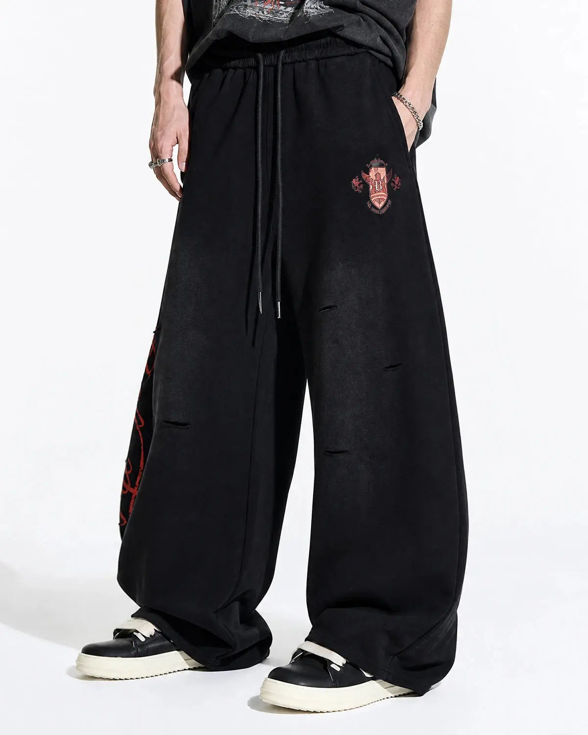 Vintage Washed Barrel Sweatpants by INFLATION featuring a relaxed fit, washed fabric, and casual streetwear style.