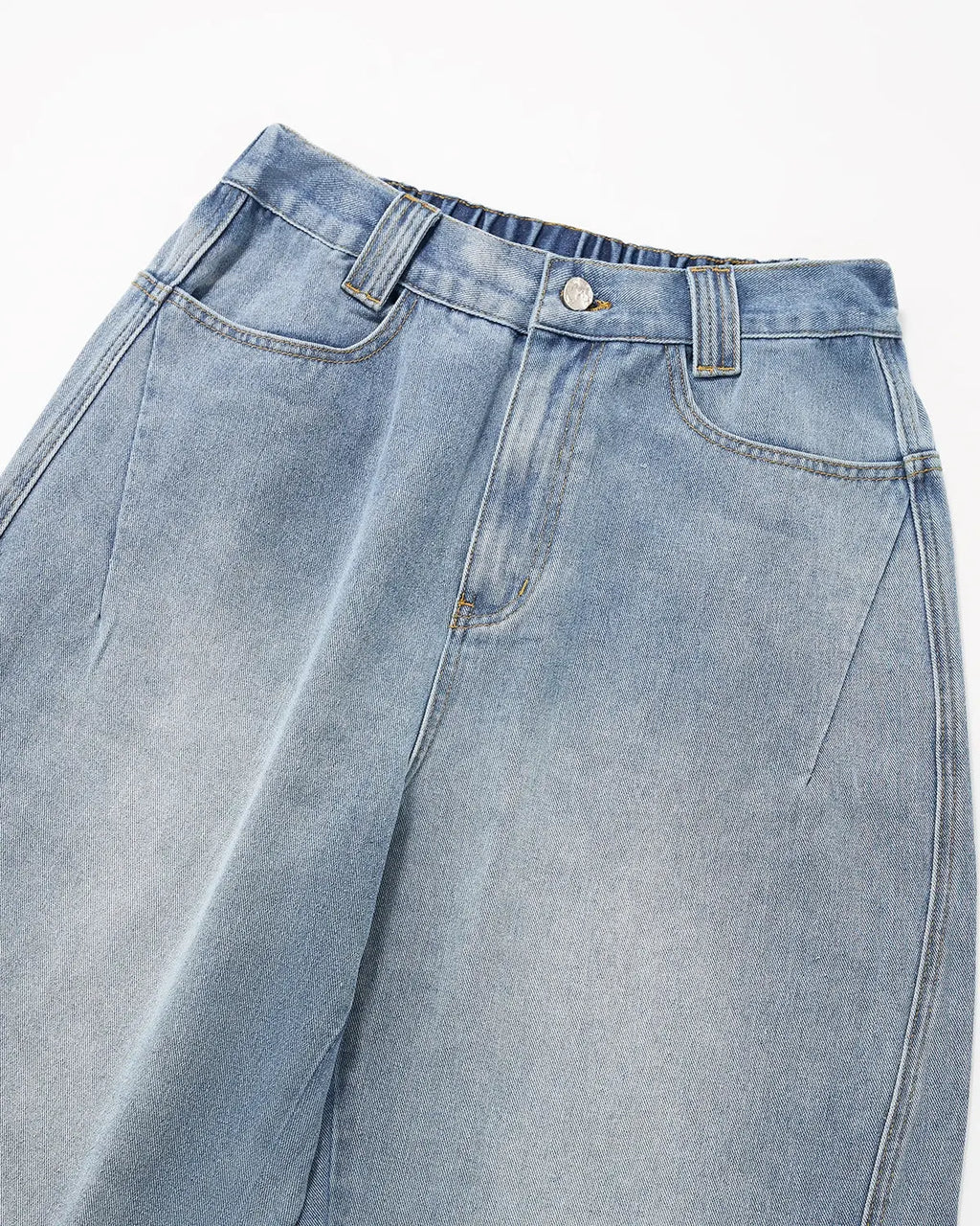 Distressed baggy cargo jeans by INFLATION featuring a relaxed fit, ripped details, and multiple cargo pockets for a streetwear look.
