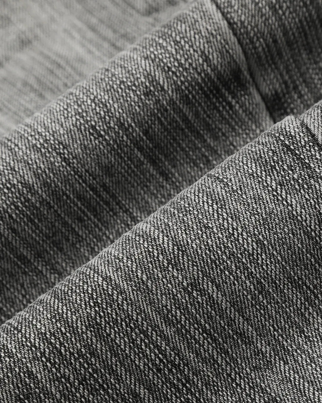 Bamboo Weave Barrel Jeans by INFLATION, stylish pants with a textured bamboo pattern and relaxed fit, displayed on a hanger.