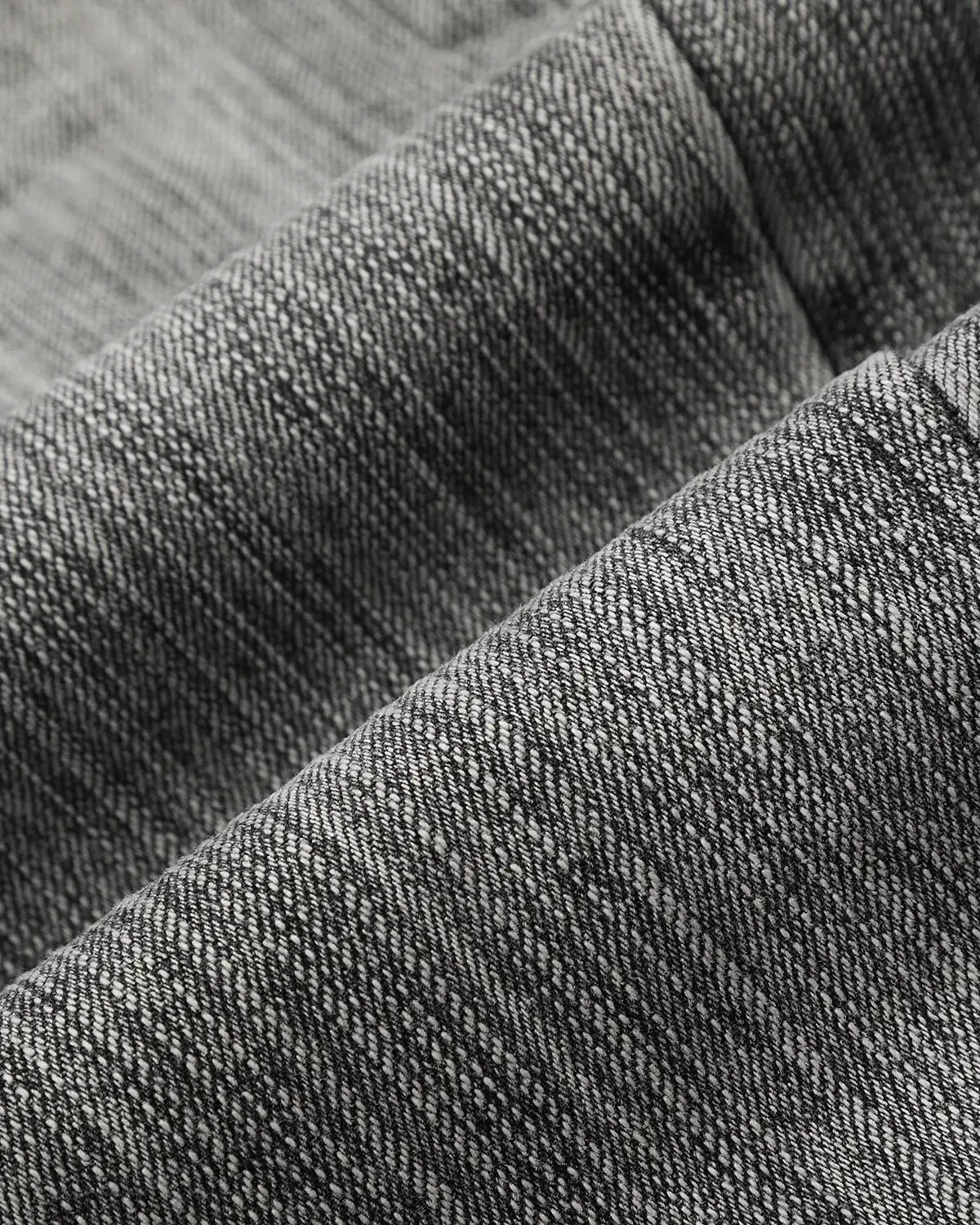Bamboo Weave Barrel Jeans by INFLATION, stylish pants with a textured bamboo pattern and relaxed fit, displayed on a hanger.