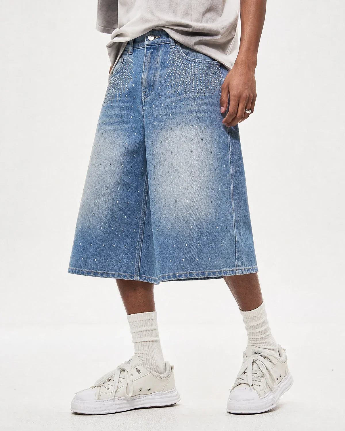 Blue rhinestone baggy jeans shorts from INFLATION with a relaxed fit, featuring rhinestone embellishments and casual streetwear style.
