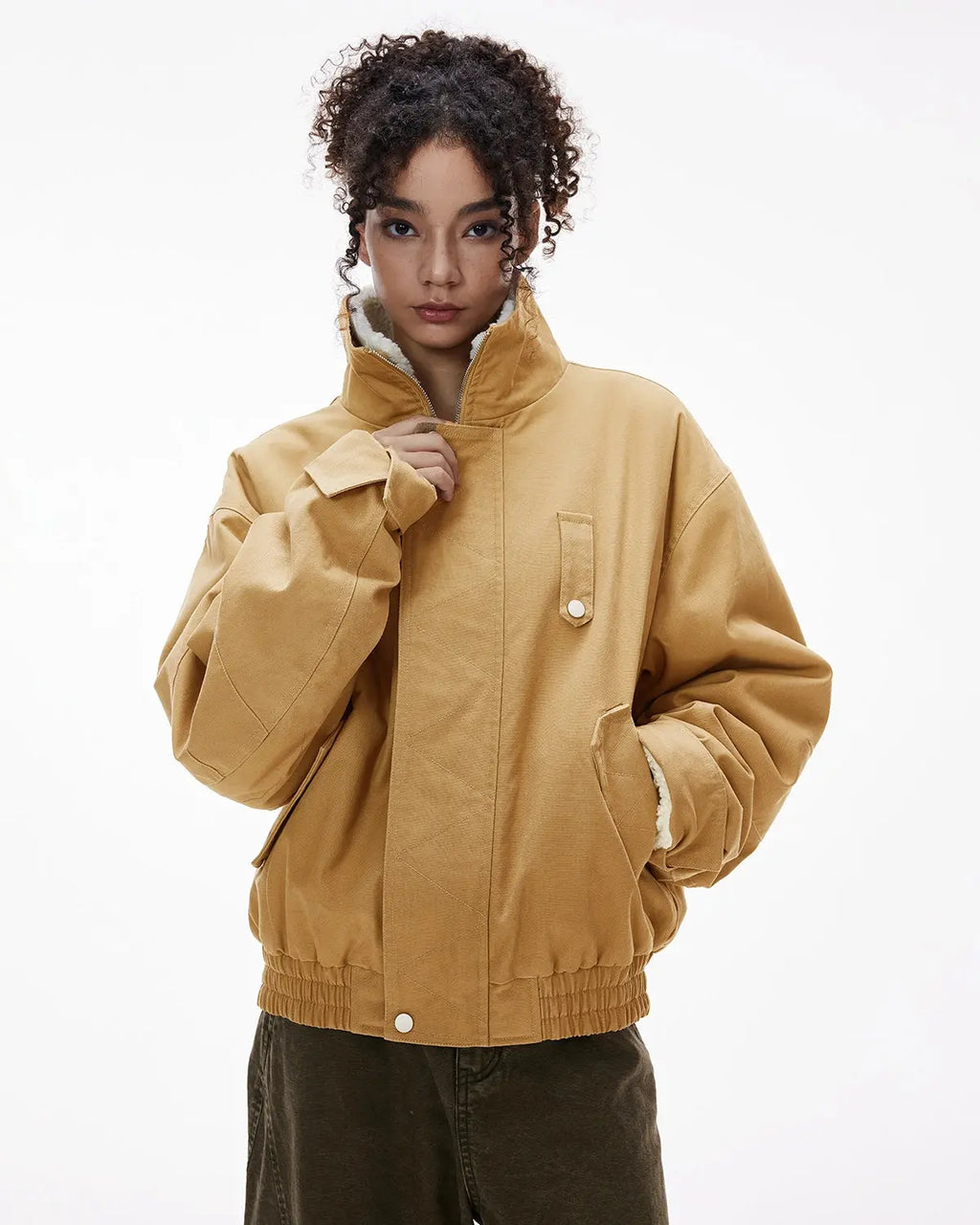 INFLATION faux shearling lining lambswool jacket with cozy interior and stylish streetwear design, displayed on a hanger.