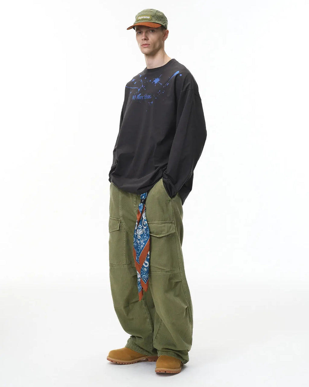 Inflation streetwear cargo pants with multiple pockets, garment washed for a casual, rugged look, shown on a model.