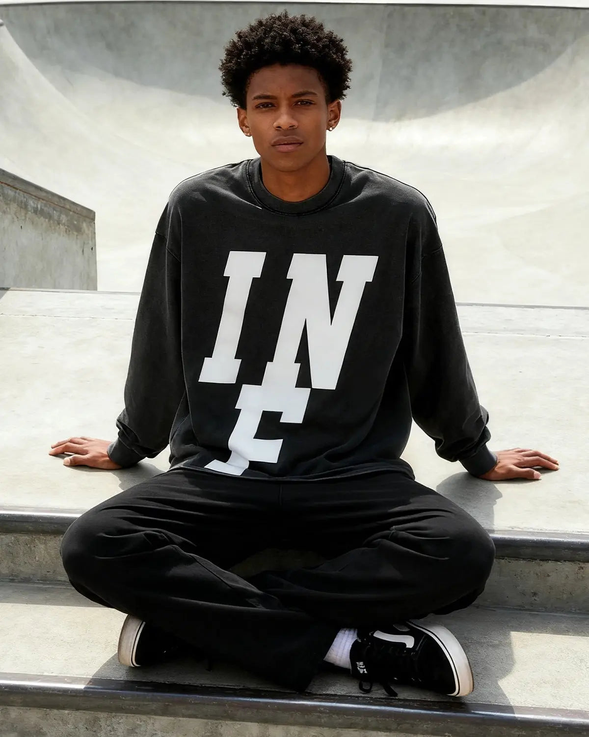 Inflation Streetwear reflective logo acid wash tee featuring a casual fit and distressed look with prominent brand logo design.