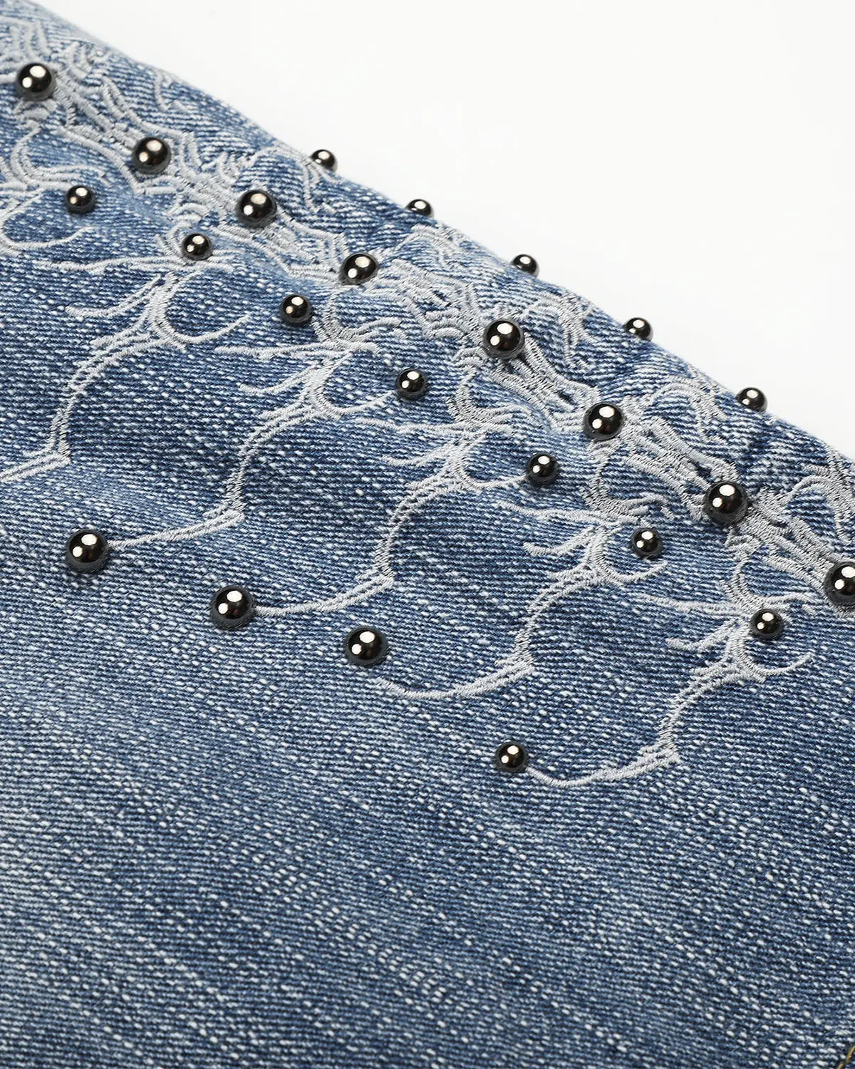 Inflation brand studded bamboo weave jorts, stylish denim-style pants with metal stud accents and a rugged, woven bamboo design.