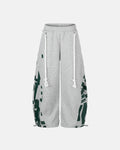 Graphic Barrel Sweatpants by INFLATION featuring bold graphic details and relaxed fit in stylish streetwear design.
