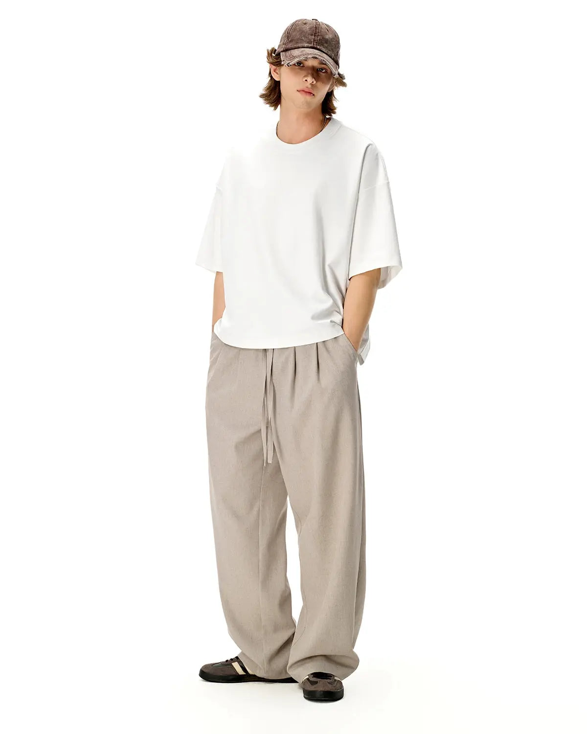 Blank oversized boxy T-shirt by INFLATION, featuring a relaxed fit and minimal design, displayed on a hanger.