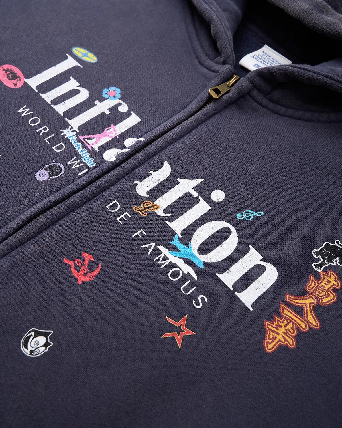 Inflation Streetwear graphic acid washed zip-up hoodie with front pockets and hood, featuring a distressed, vintage-inspired design.