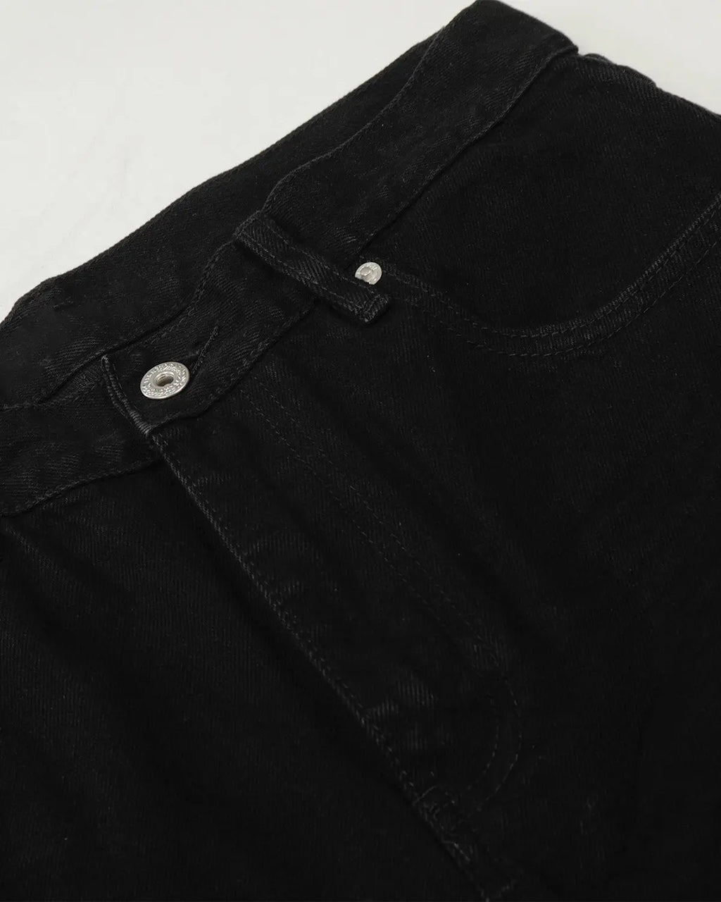 Black baggy jeans from Inflation Streetwear featuring a relaxed fit and casual style, shown on a model.