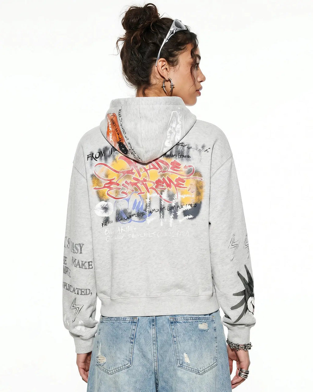 Boxy graffiti zip-up hoodie by INFLATION Streetwear featuring bold graffiti designs, front zipper, and a relaxed fit.