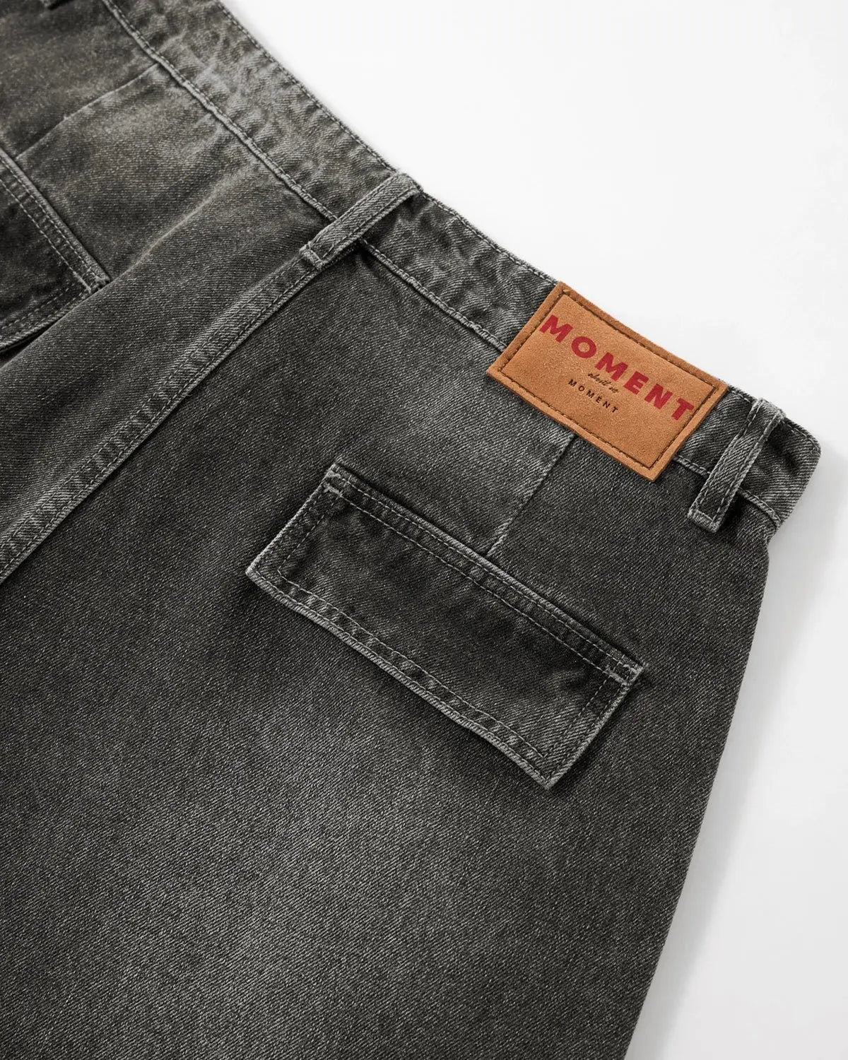 Distressed washed cargo barrel jeans from INFLATION featuring a relaxed streetwear style with rugged, faded denim and multiple pockets.