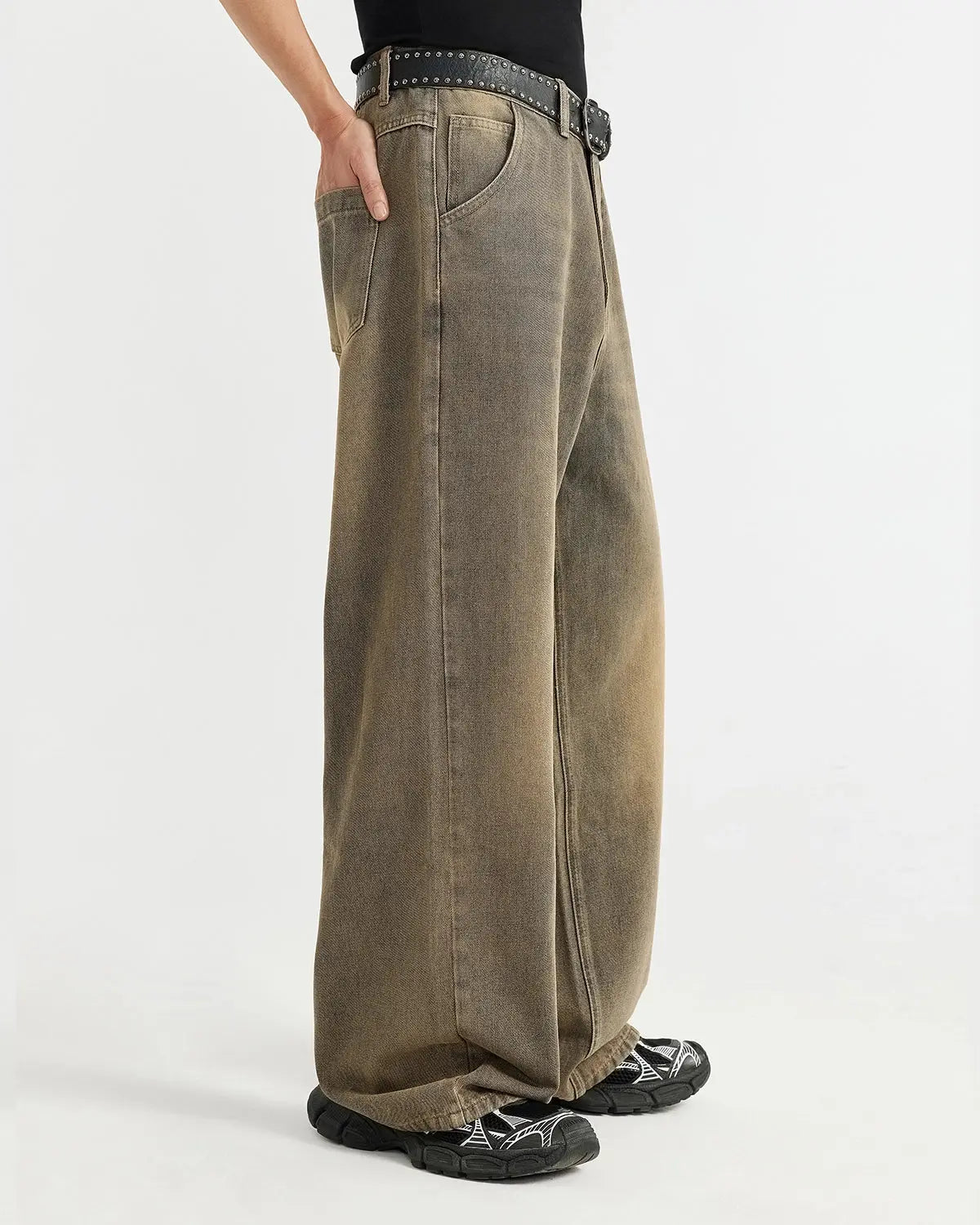 Brown acid wash baggy jeans from Inflation Streetwear featuring relaxed fit and faded distressed denim style.