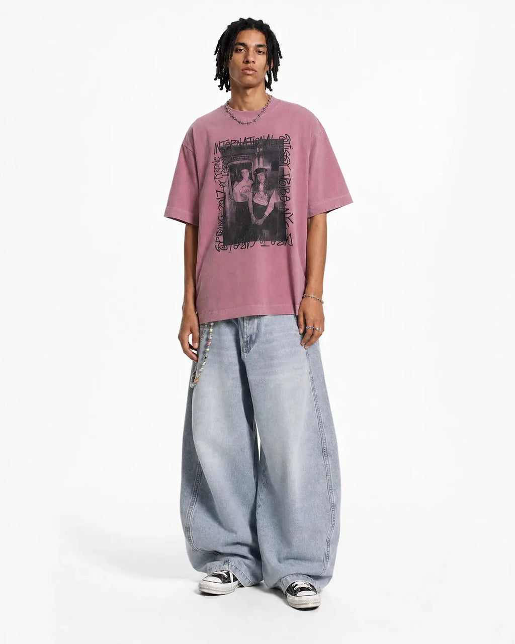 Vintage graphic washed oversized T-shirt by INFLATION featuring a retro streetwear design on soft, faded fabric.
