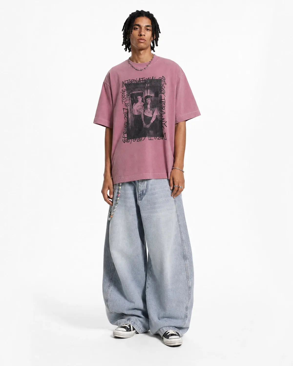 Vintage graphic washed oversized T-shirt by INFLATION featuring a retro streetwear design on soft, faded fabric.