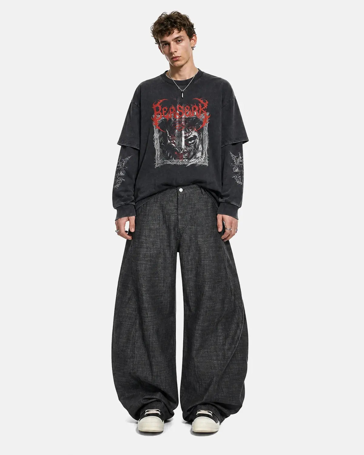 Lightweight raw barrel jeans by INFLATION featuring a relaxed fit and raw denim finish, displayed on a model.