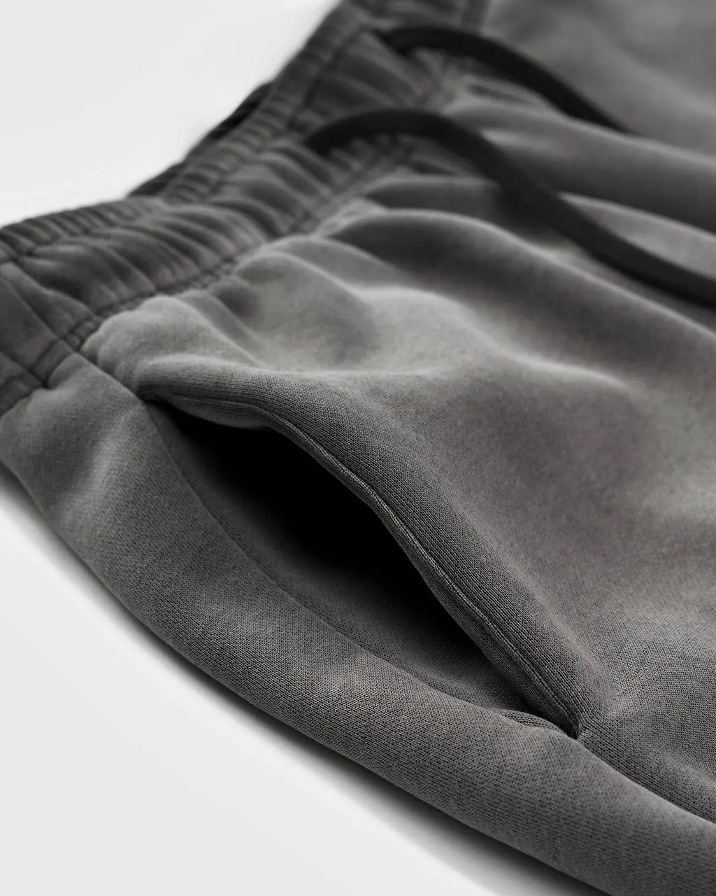 Acid washed INFLATION streetwear sweatpants with relaxed fit and casual style, shown on a model.