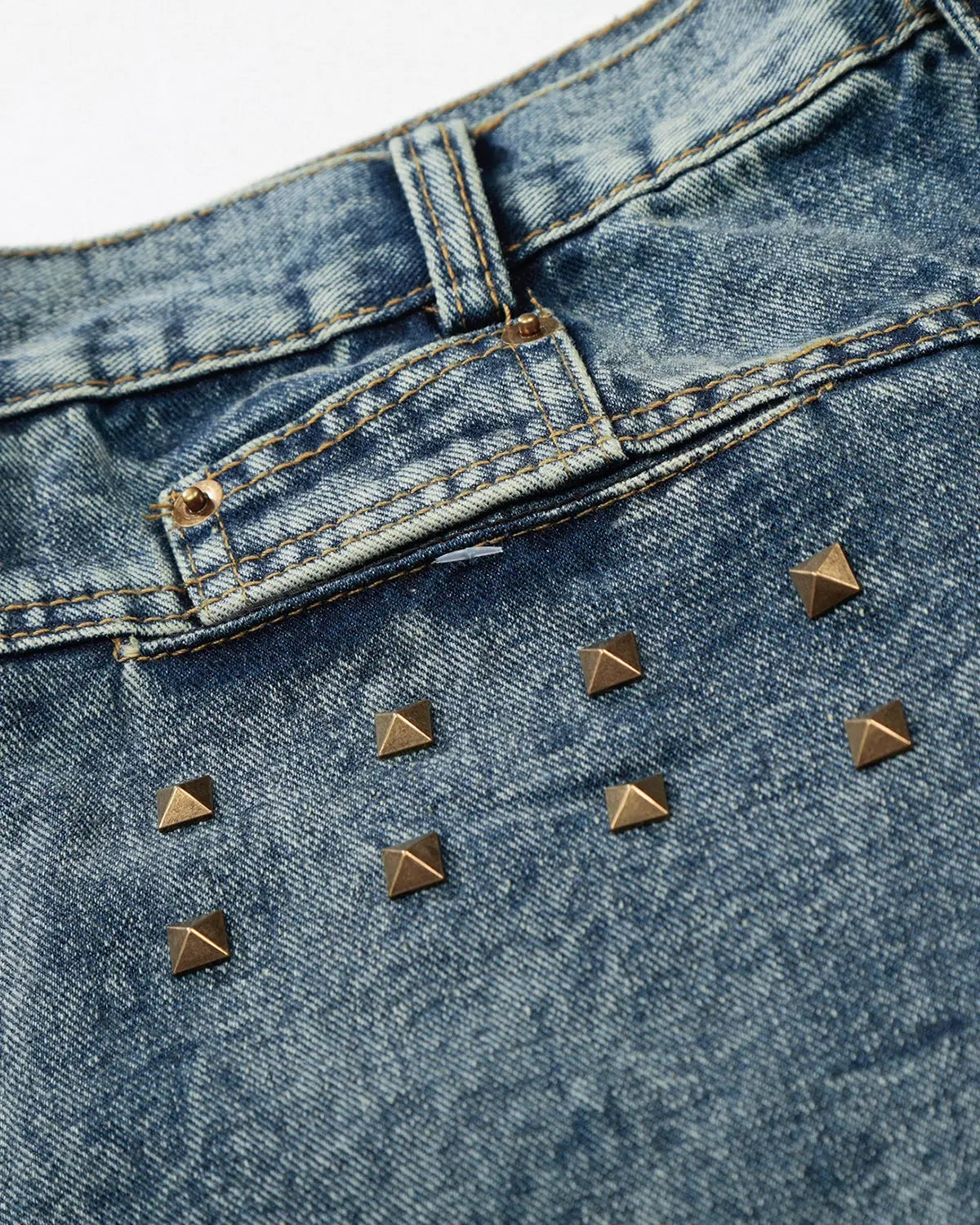 Inflation brand studded washed long baggy jorts, denim pants with metal stud details and a relaxed, oversized fit.